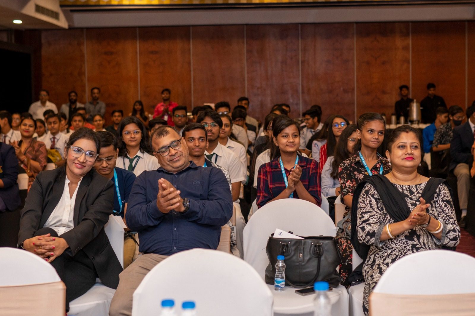 Audience applauding at a career event in a hall
