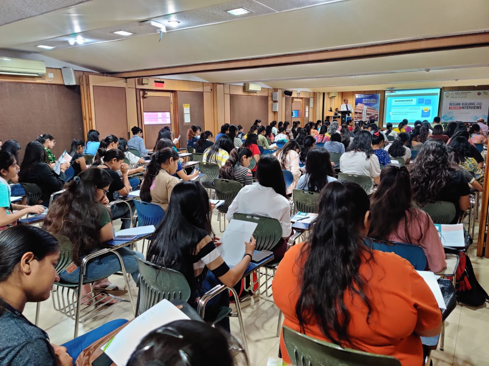 College students attending a workshop on resume building and facing interviews